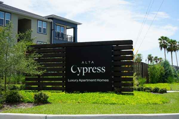 apartment building with sign that says 'Alta Cypress'