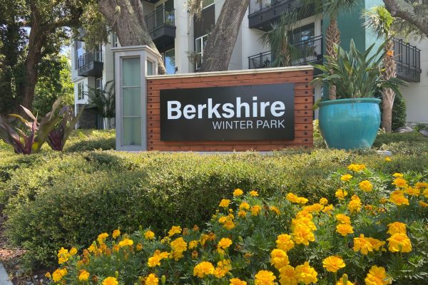 wooden sign behind yellow flowers reads 'Berkshire Winter Park'