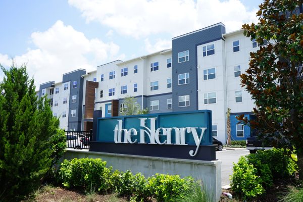 apartment building with sign that says 'the Henry'