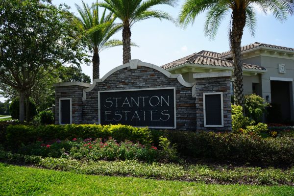 grey stone sign that reads 'stanton estates'