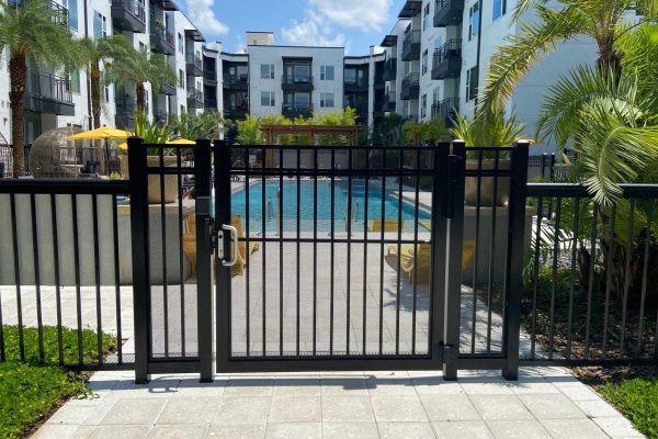 black gate in front of apartment complex pool
